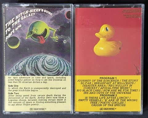 Douglas Adams – The Hitch-Hiker’s Guide To The Galaxy: Part One / Part Two – The Restaurant At The End Of The Universe (2-Cassette Set, 1982, Hannibal Records)